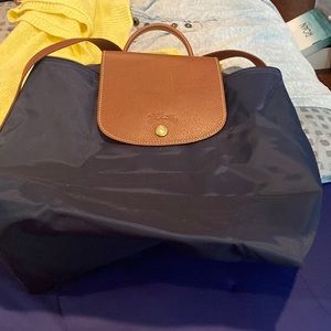 Gently used navy blue foldable back pack